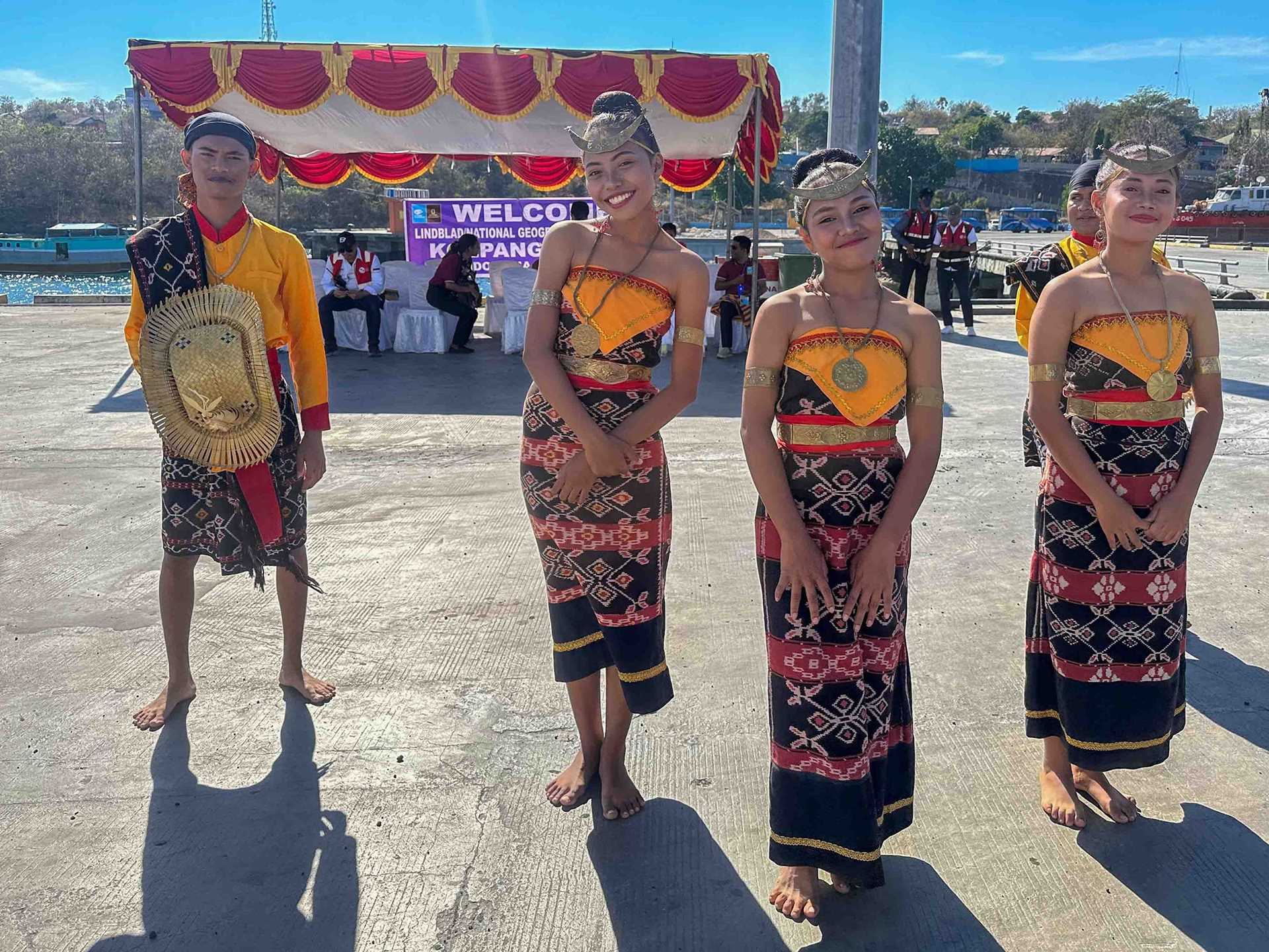 four women in traditional indonesian costume