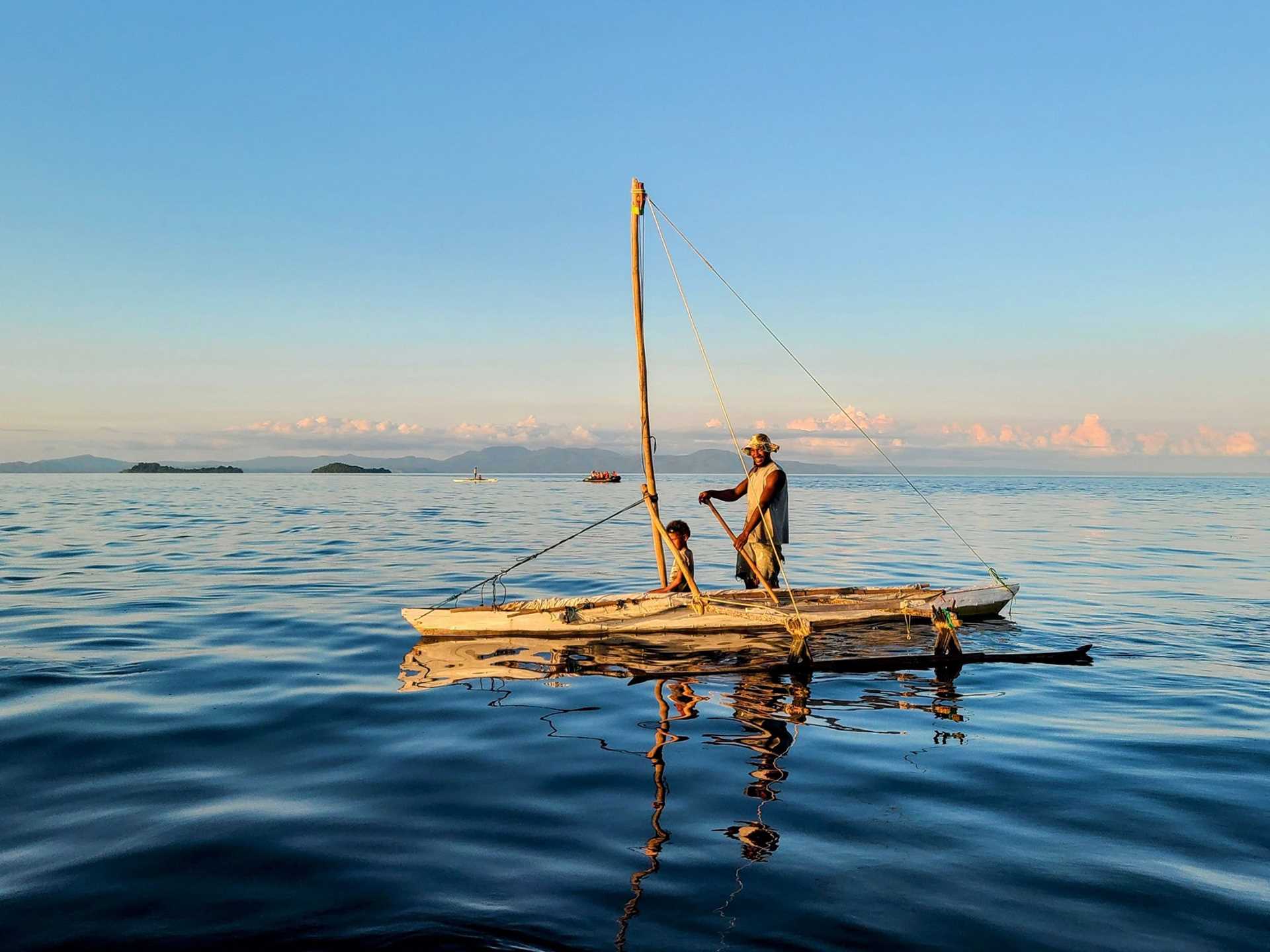 a man and a young boy on a raft 