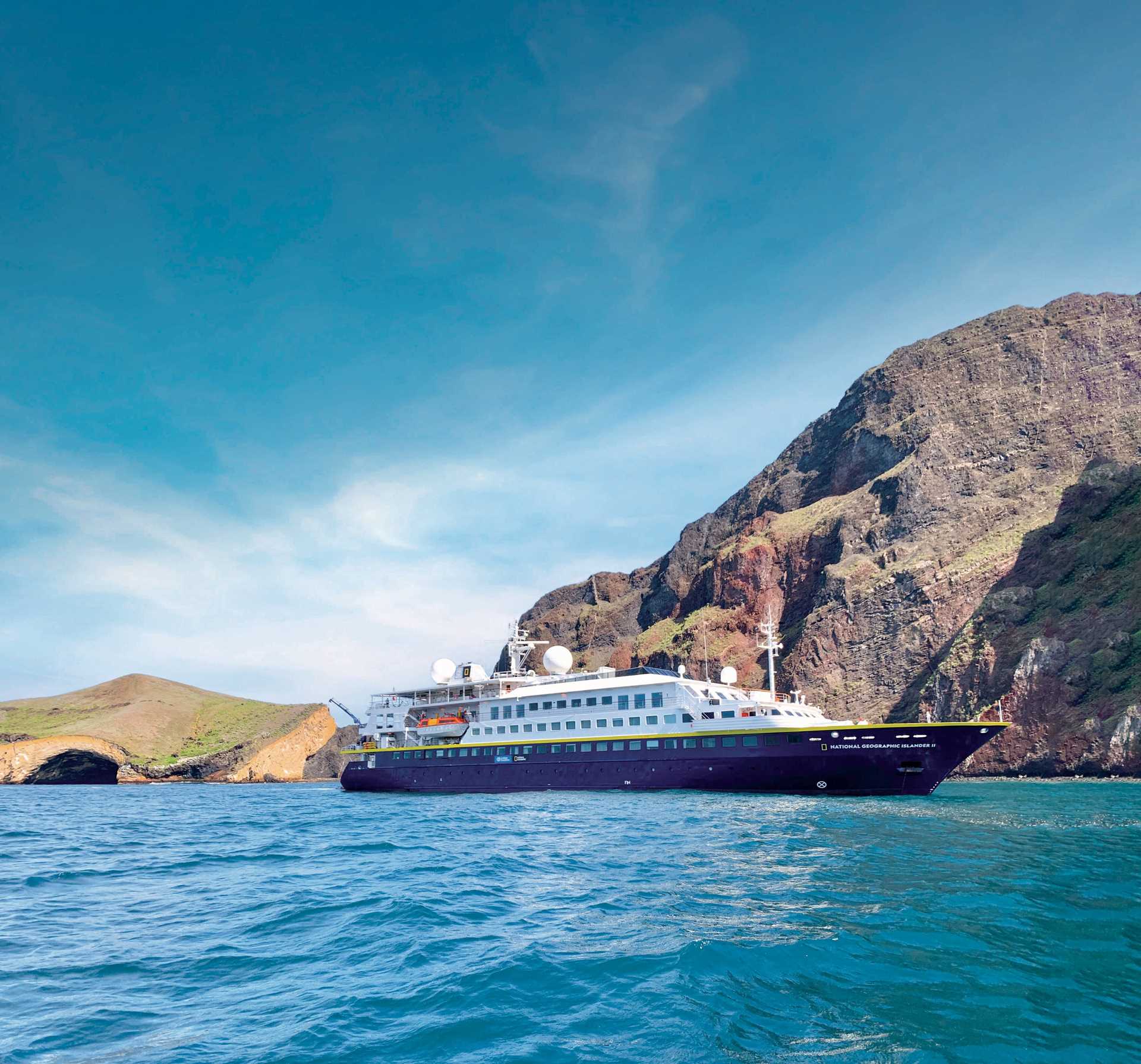 The ship National Geographic Islander II sailing in the Galápagos Islands.